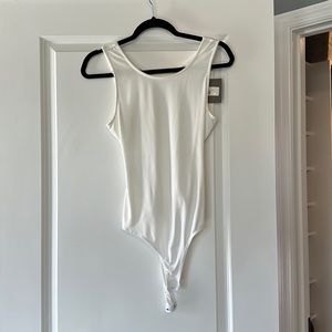 While beautiful backless bodysuit!